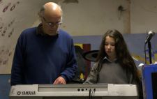 John Leyden teaching Eliza in the band room: "When we first heard her voice, it was wonderful."